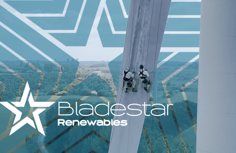 Technicians performing blade repair on a wind turbine using rope access, demonstrating real-world composite blade repair in action.